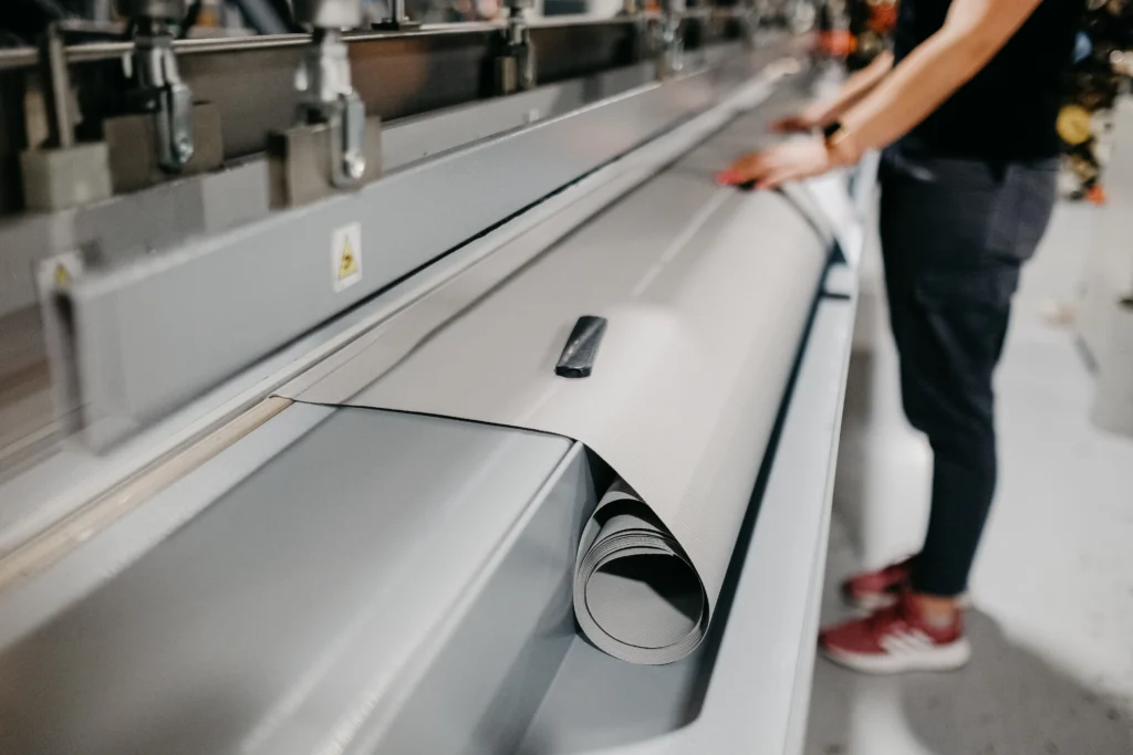 Fabric inspection machine speed being monitored during roll inspection
